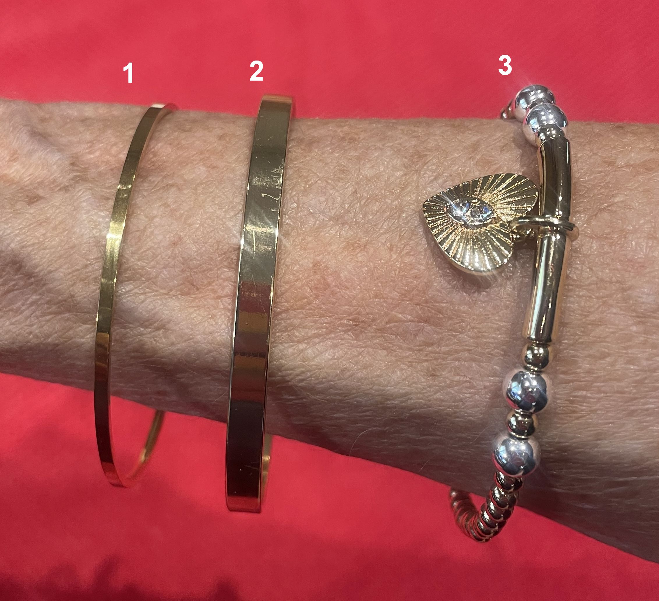 Gold Bracelets, Thin band, thick band, and Heart Charm.